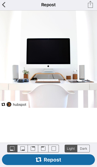 Photo of computer on Repost for Instagram app with blue button to repost photo